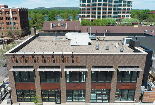 Rooftop view La Crosse Distilling Co's new roof applied by Ledegar Roofing Company in La Crosse, WI.