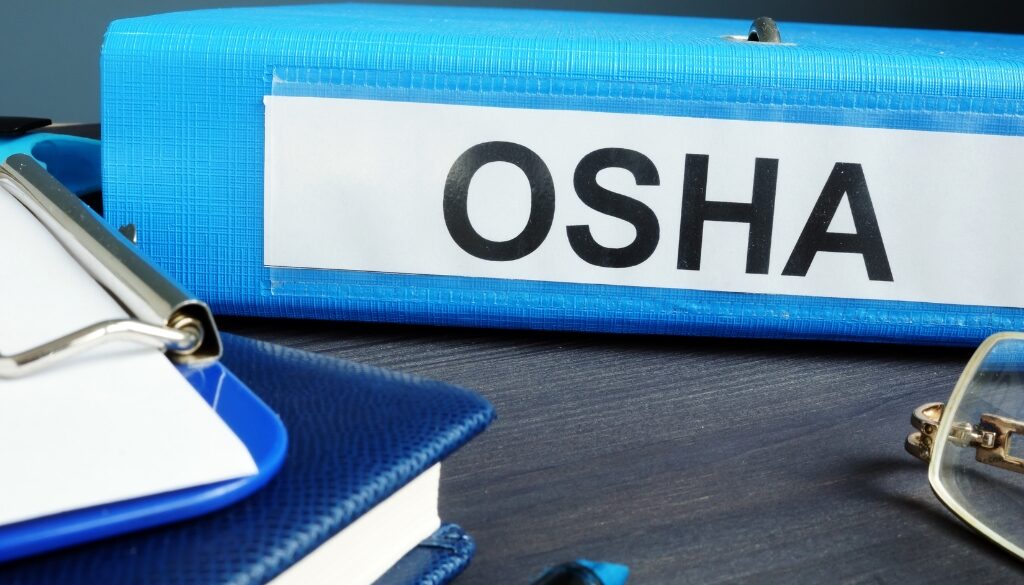 A binder labeled with OSHA.