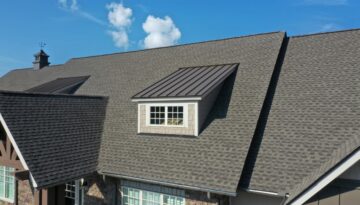 A newly installed residential roof with singles and metal.