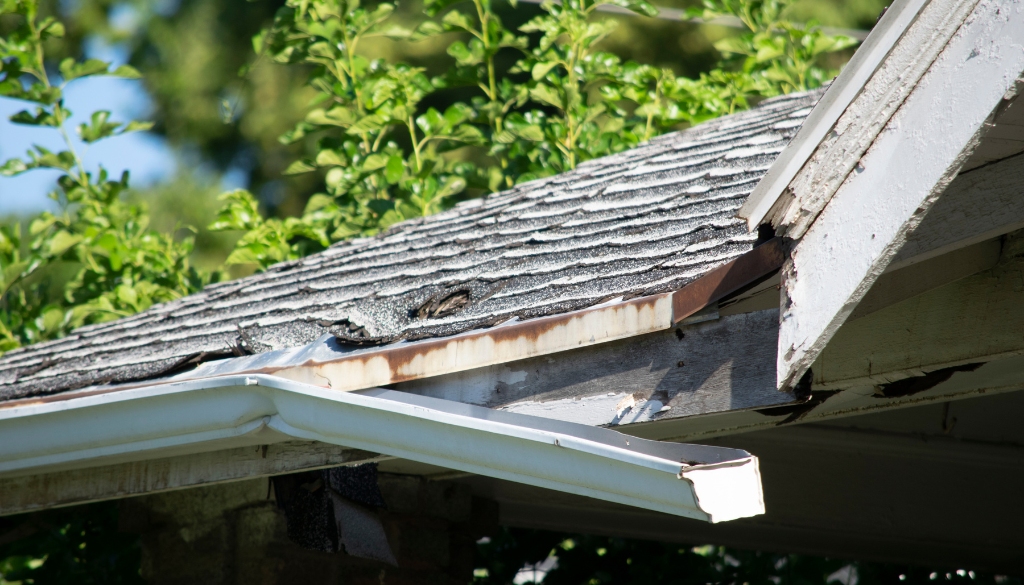 Severely damaged gutters on a resident home.