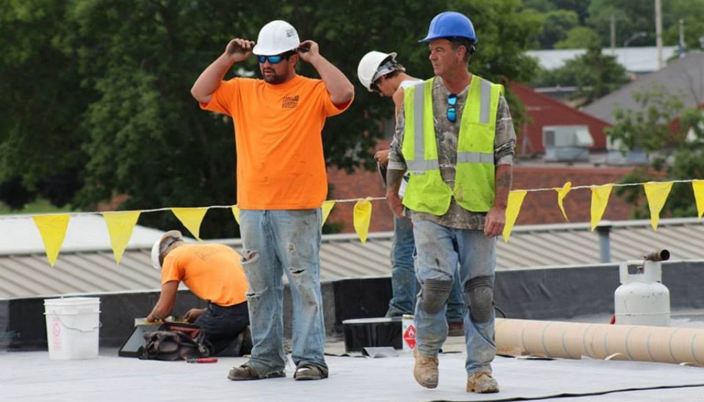 A Ledegar Roofing Foreman supervises a commercial roof maintenance project in La Crosse, Wisconsin.