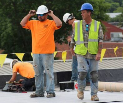 A Ledegar Roofing Foreman supervises a commercial roof maintenance project in La Crosse, Wisconsin.