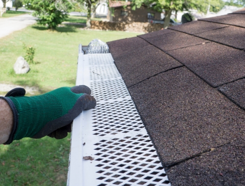 White residential gutter guards.