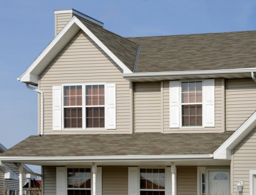 A nice residential home with a robust newly installed gutter system.