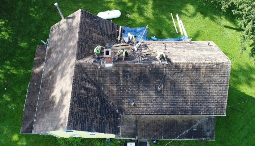 Ledegar roofing employees replace a residential roof.