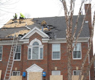 Ledegar Roofing employees replacing a roof on a home in the spring in La Crosse, Wisconsin.