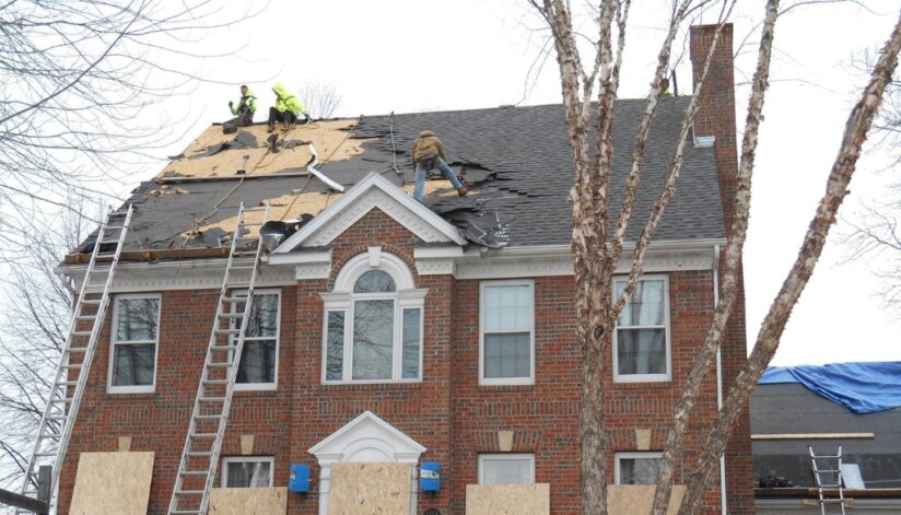 Ledegar Roofing employees replacing a roof on a home in the spring in La Crosse, Wisconsin.