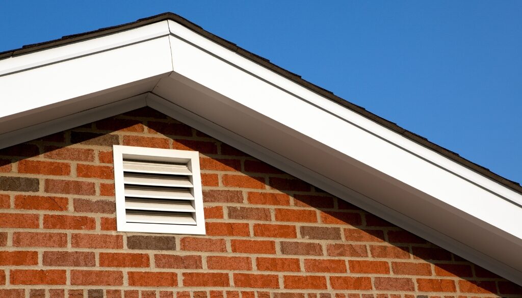 The outside of a properly ventilated attic on a brick house