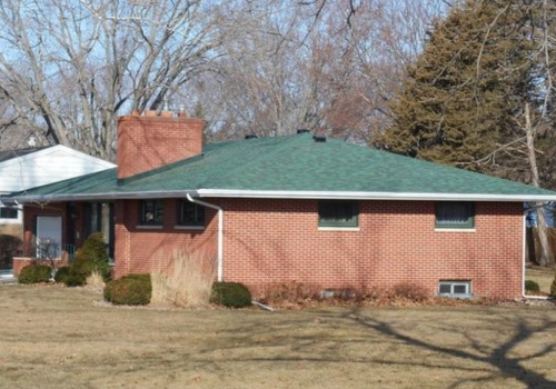 Residential home in La Crosse, WI with new gutters from Ledegar Roofing. 