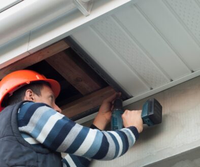 Ledegar Roofing expert installing soffit on a residential home.