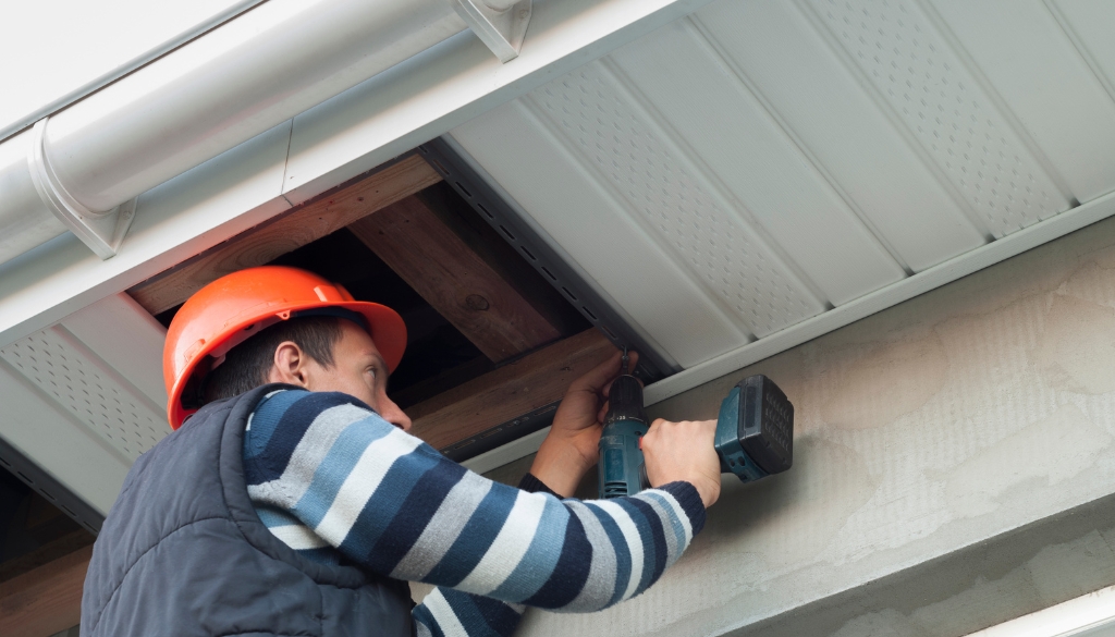 Ledegar Roofing expert installing soffit on a residential home.