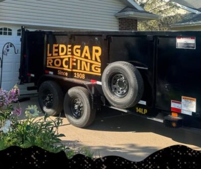 Ledegar Roofing trailer parked in a driveway