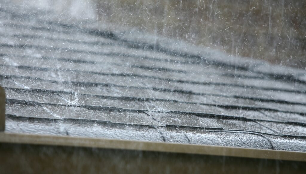 Rain drops falling on a roof.