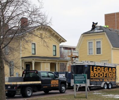 Ledegar Roofing experts replacing Hixon House's historic carriage house's roof in La Crosse, Wisconsin.