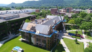 An aerial view of Ledegar Roofing working on UW-La Crosse campus building during business hours.