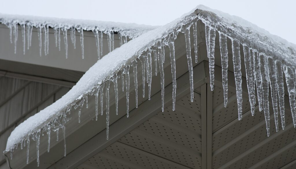 Icicles hanging off a residential home's roof