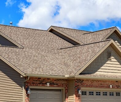 House with a brown roof. The roof has many peaks and valleys.